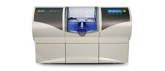 Same-day Dentistry with CEREC Crown Being Milled By CEREC